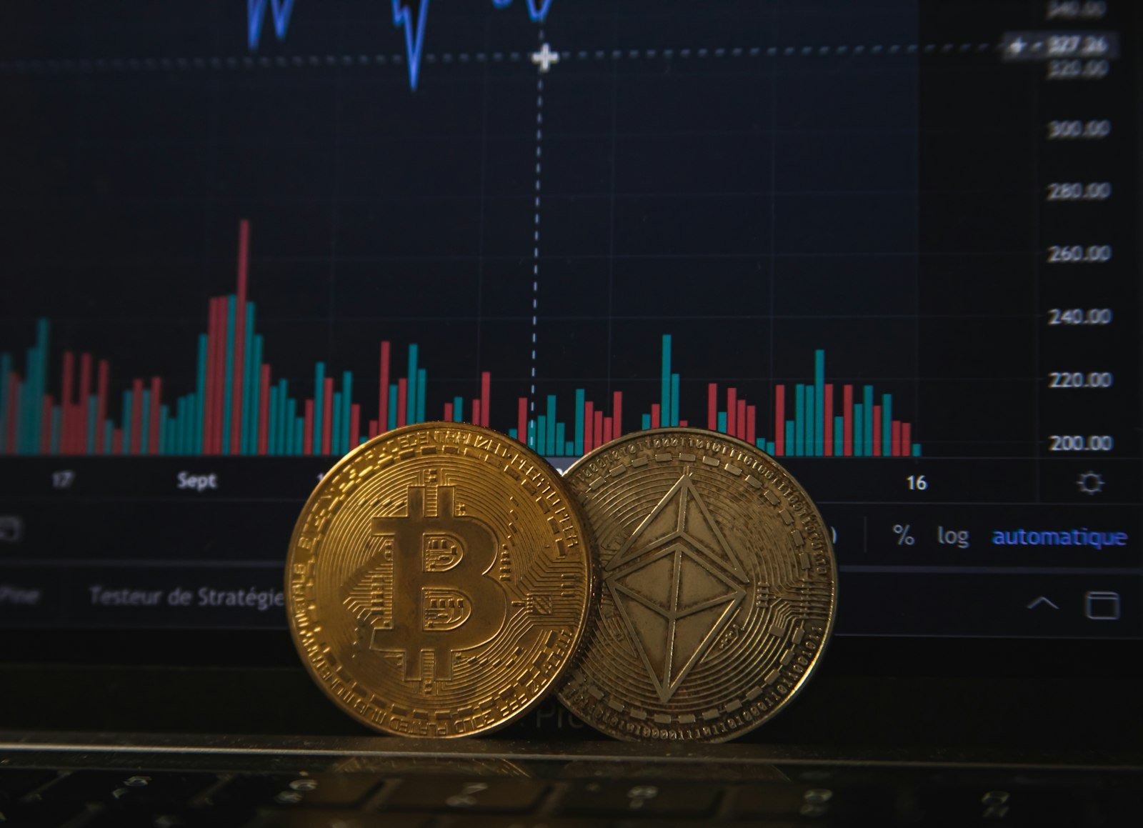 How to Buy Crypto ETNs in the UK: 2026 Guide to Rules, ISAs and Fees 1 Bitcoin and Ethereum coins on a laptop keyboard